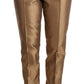 Eleganti pantaloni affusolati in seta color oro