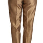 Eleganti pantaloni affusolati in seta color oro