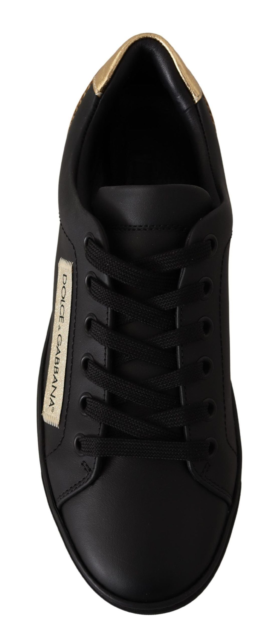 Schicke schwarze und goldene Low-Top-Sneakers aus Leder