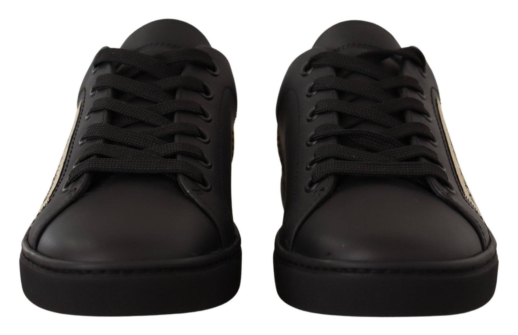 Schicke schwarze und goldene Low-Top-Sneakers aus Leder