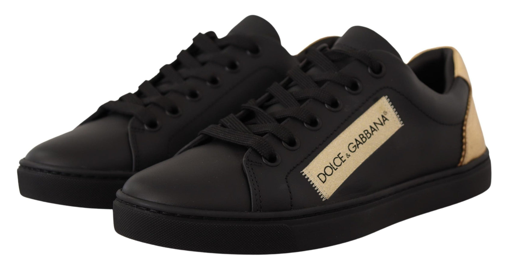 Schicke schwarze und goldene Low-Top-Sneakers aus Leder