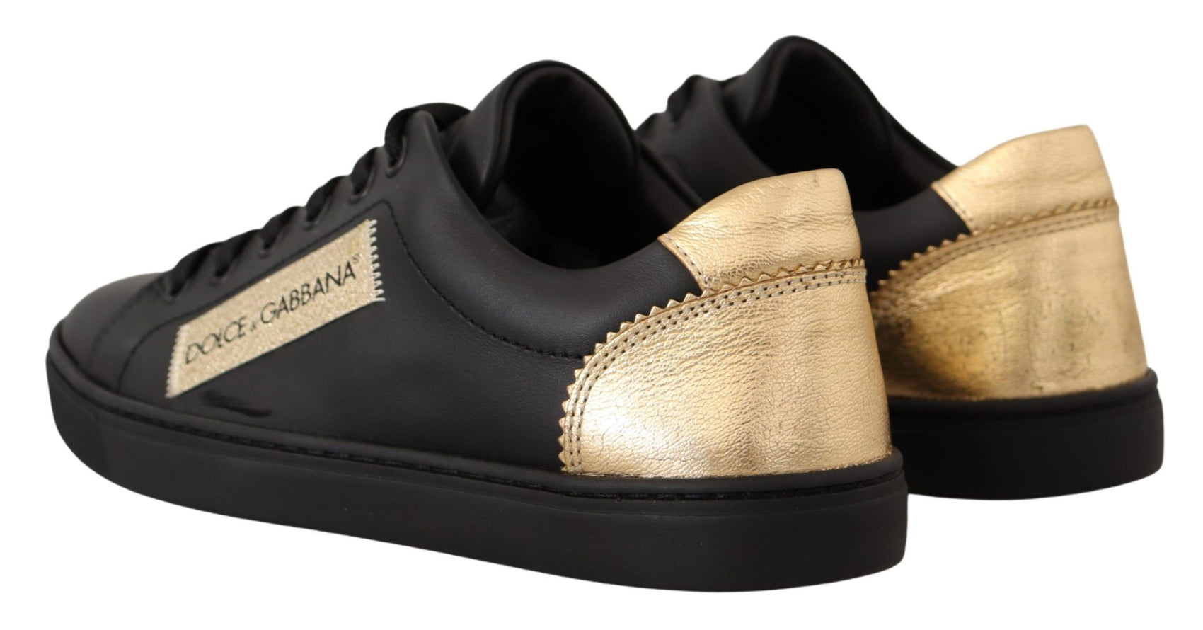 Schicke schwarze und goldene Low-Top-Sneakers aus Leder