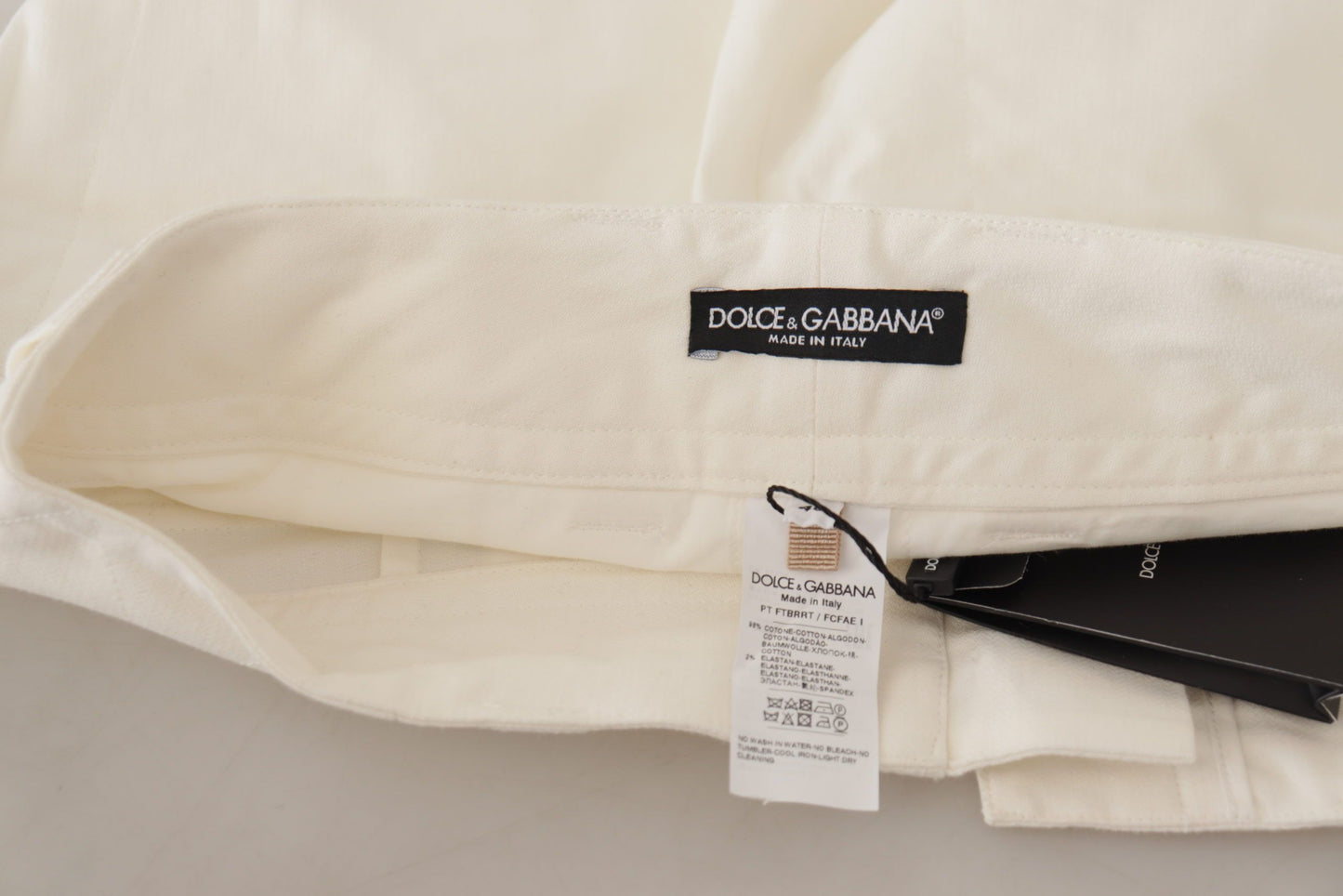 Eleganti pantaloni bianchi a vita alta affusolati