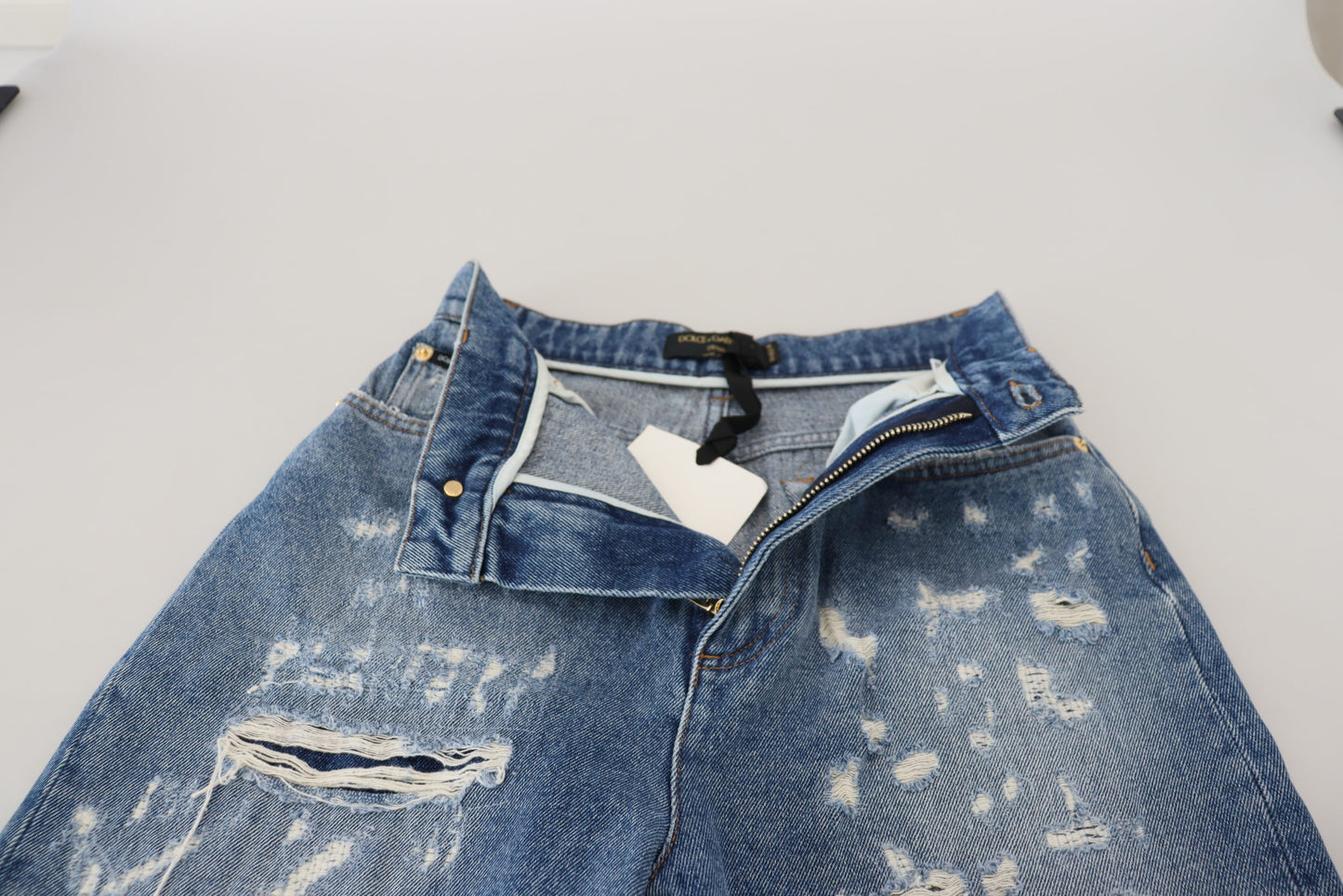 Pantaloni in denim stracciati chic - Indigo Essence