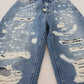 Pantaloni in denim stracciati chic - Indigo Essence