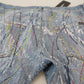 Exquisite Jeanshose mit Farbspritzern