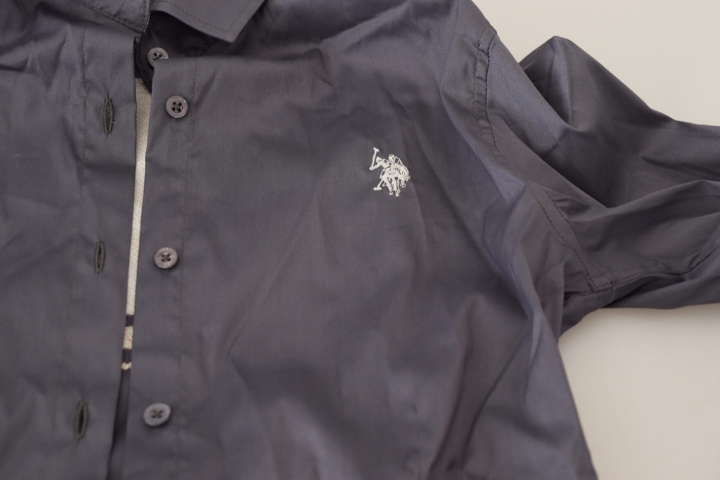 Elegante polo a maniche lunghe grigia