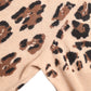 Elegante dolcevita in lana con motivo leopardato beige