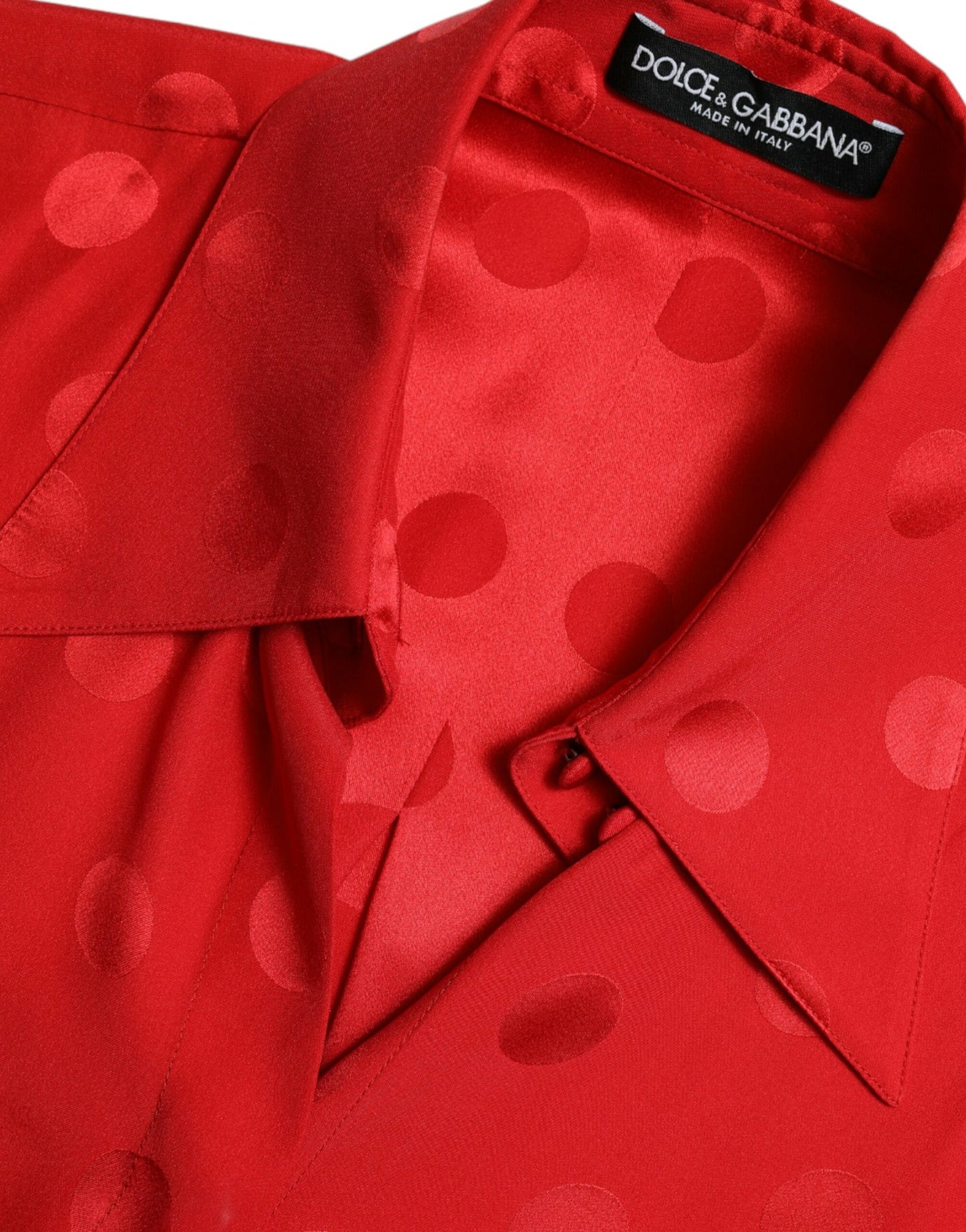 Elegante camicetta senza maniche in seta a pois
