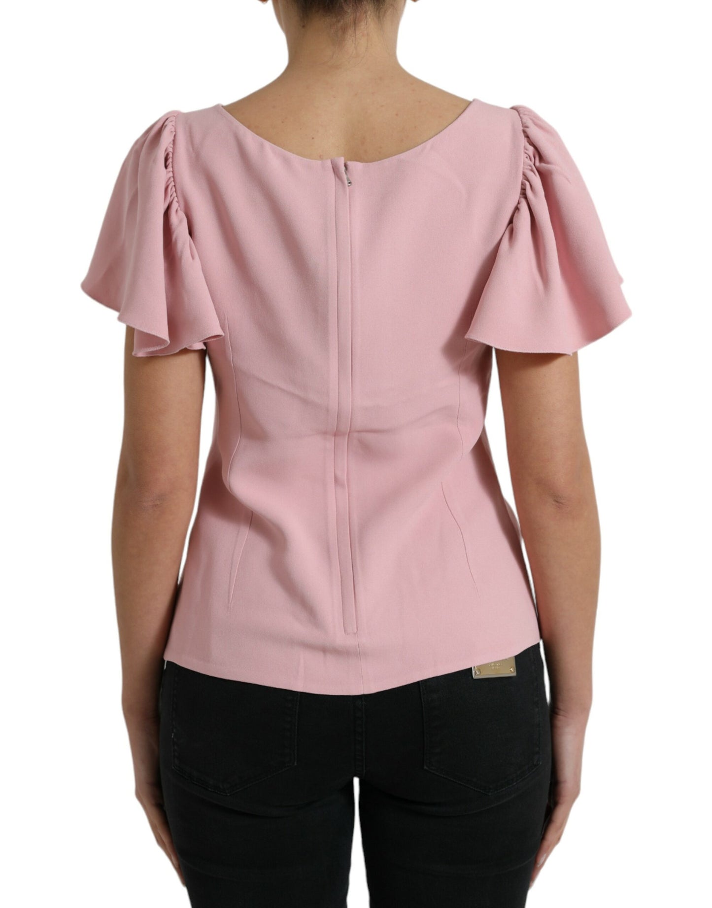 Top elegante rosa con maniche a campana