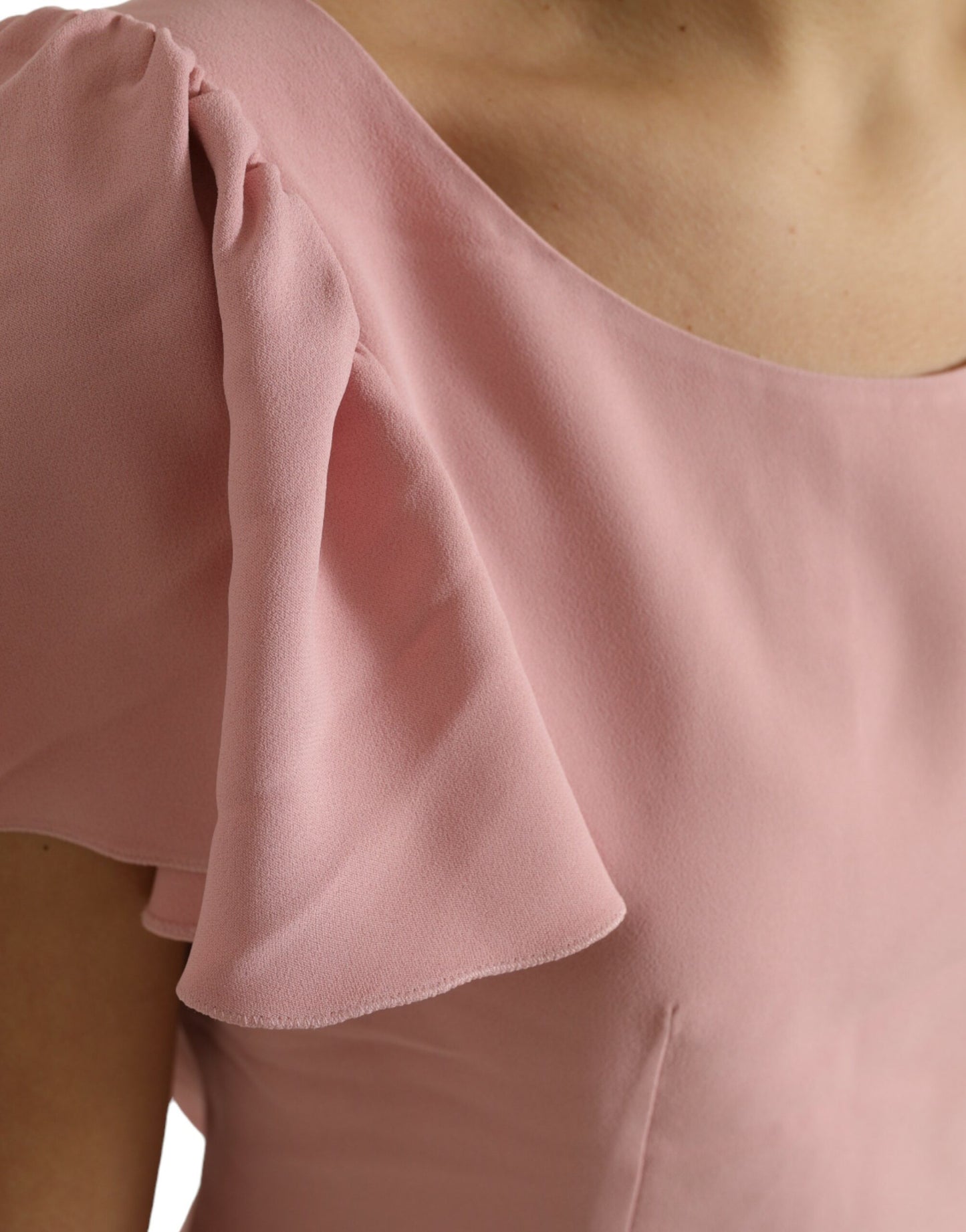 Top elegante rosa con maniche a campana