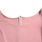 Top elegante rosa con maniche a campana