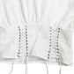 Elegante corsetto bianco con lacci e top corto