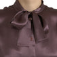 Elegante camicetta in seta con colletto ascot