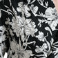 Schwarz-weißes Freizeithemd mit Blumenmuster und Knopfleiste