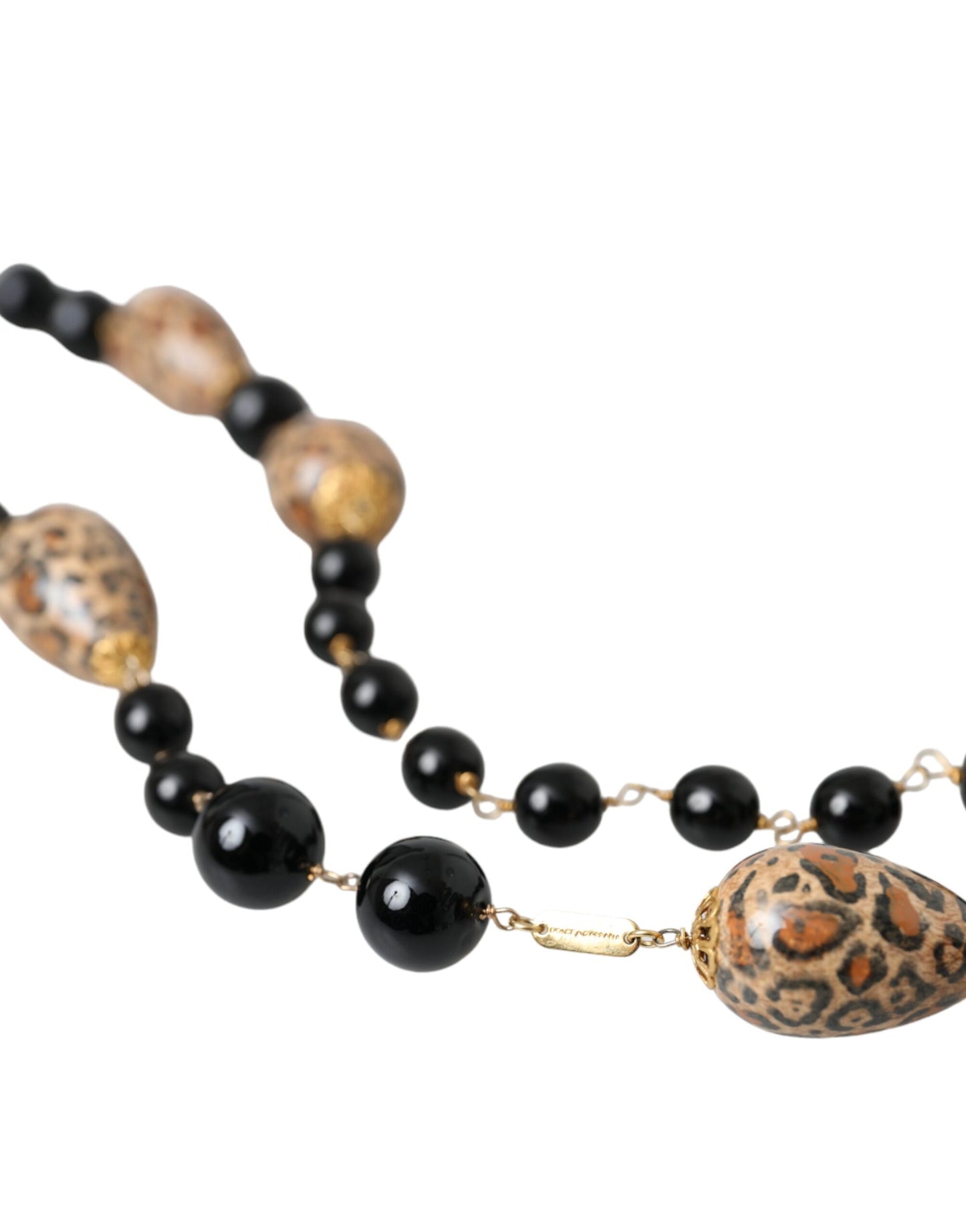 Collana lunga con perline stampate nere in ottone color oro