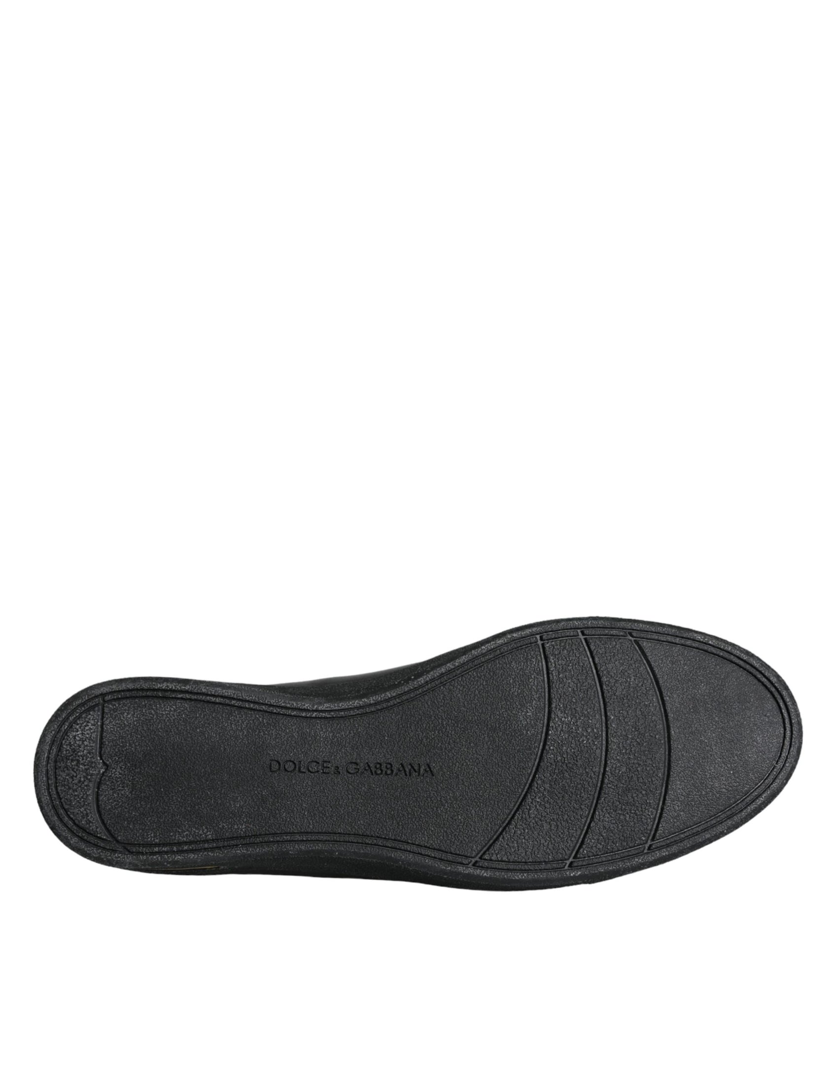 Klassische Sneakers aus schwarzem und goldenem Leder