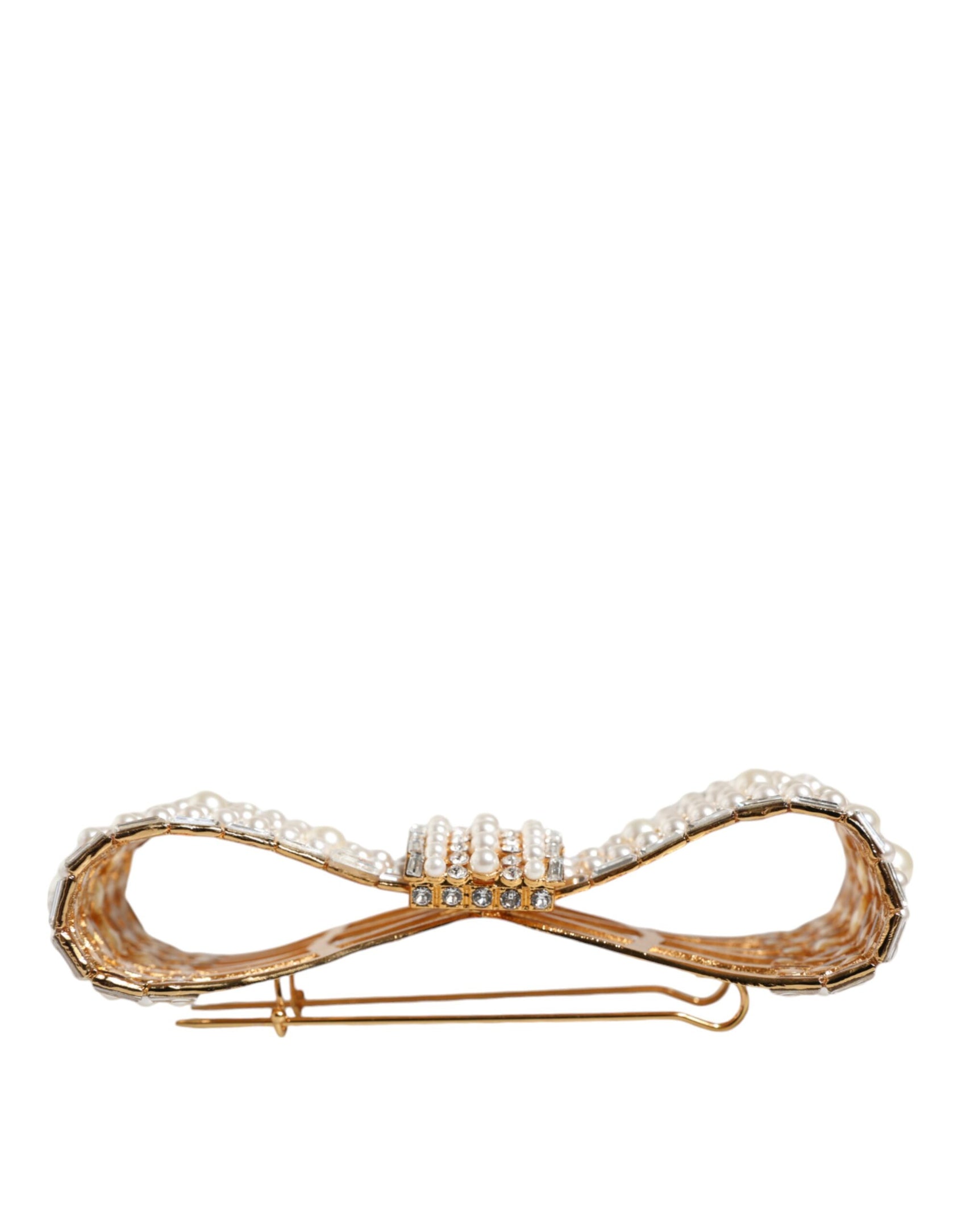 Spilla in ottone color oro con fiocco in cristallo e perla sintetica