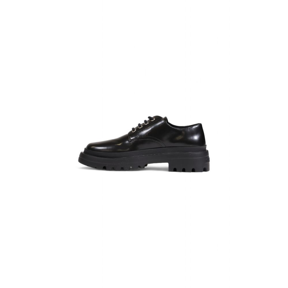 Schwarzer flacher Schuh aus Polyethylen