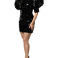 Schwarzes Minikleid aus Lackleder mit Puffärmeln