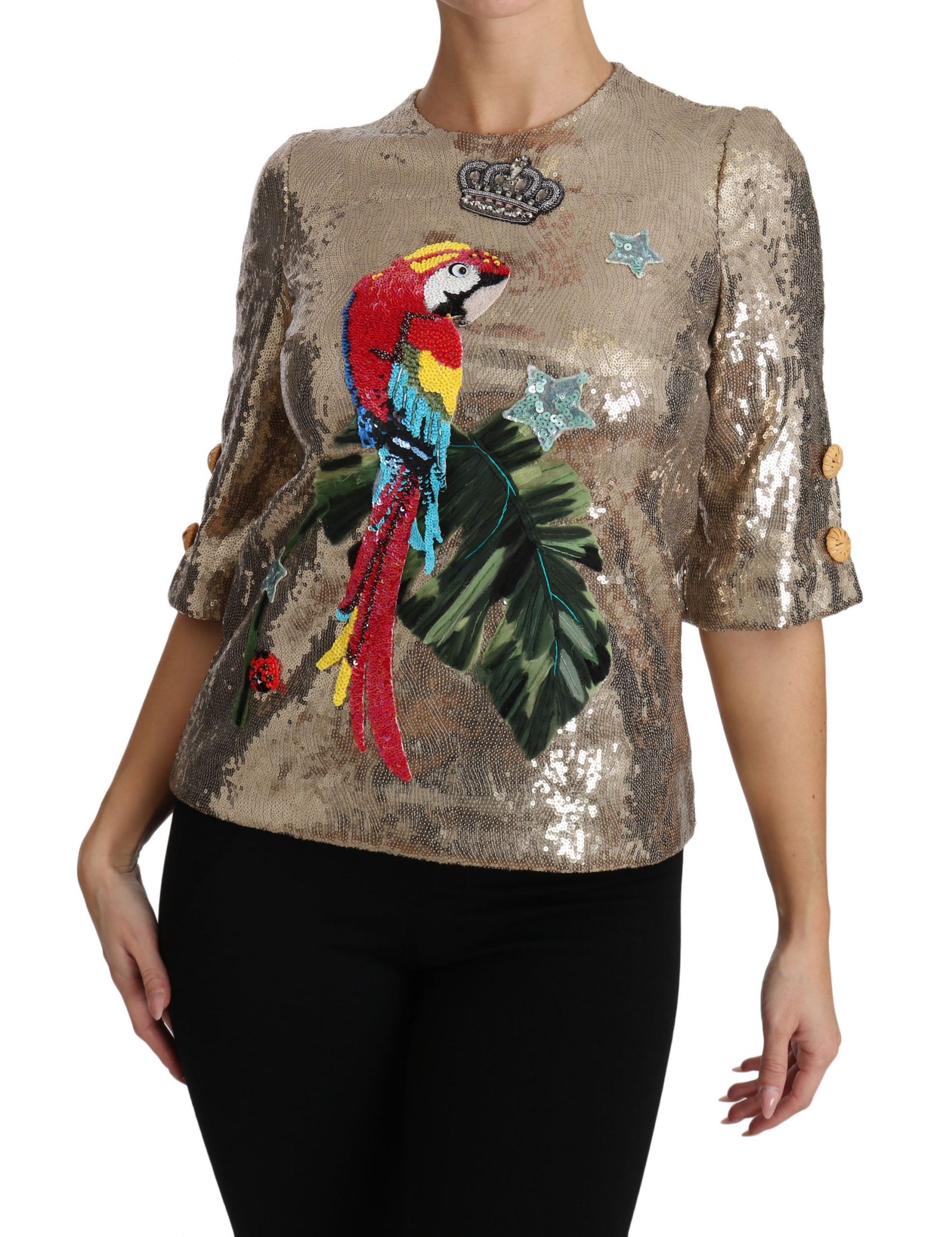 Rundhalsbluse mit goldenem Papageienmotiv und Kristallen