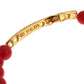 Elegante bracciale in perline di corallo rosso e oro